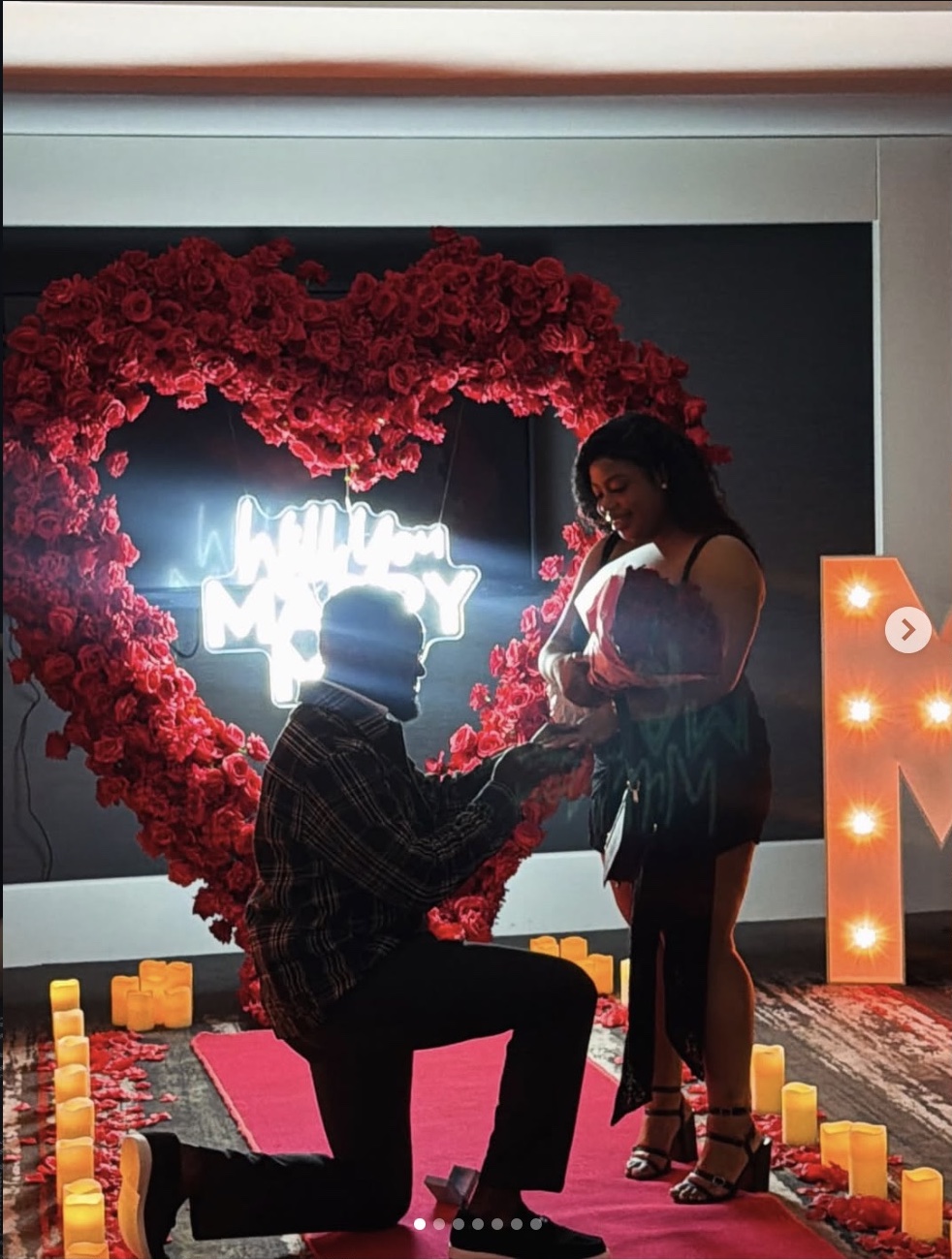 Red rose heart, glowing proposal sign and candlelit proposal styling